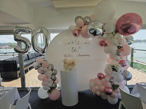 50th Wedding Anniversary Balloon Garland on 2m White Acrylic Backdrop - Everything Party