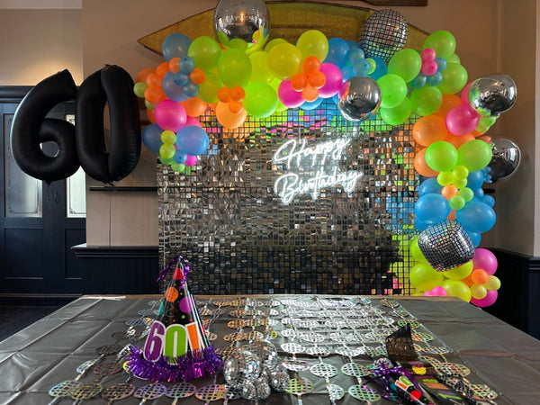 Disco Theme - Silver Shimmer wall with Balloon Garland and Neon sign - Everything Party