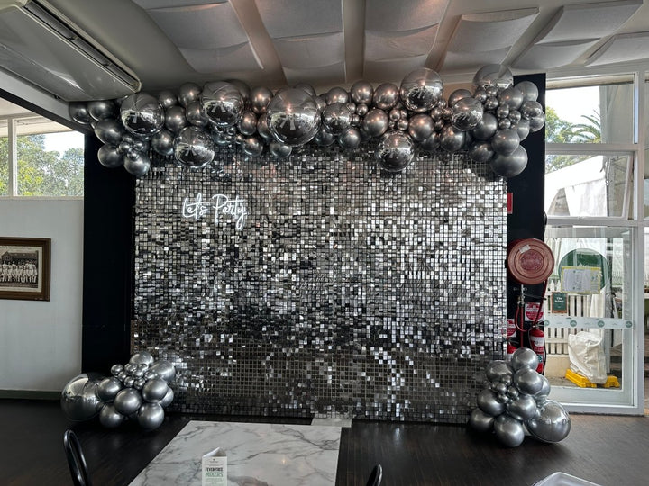 Silver Orbz & Latex Balloon Garland with Silver Shimmer Wall and Neon Sign - Everything Party