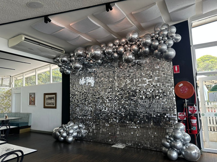 Silver Orbz & Latex Balloon Garland with Silver Shimmer Wall and Neon Sign - Everything Party